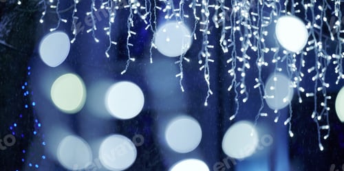 Preview: Blue lights bokeh from christmas holiday garlands, blurred festive background, abstract lights