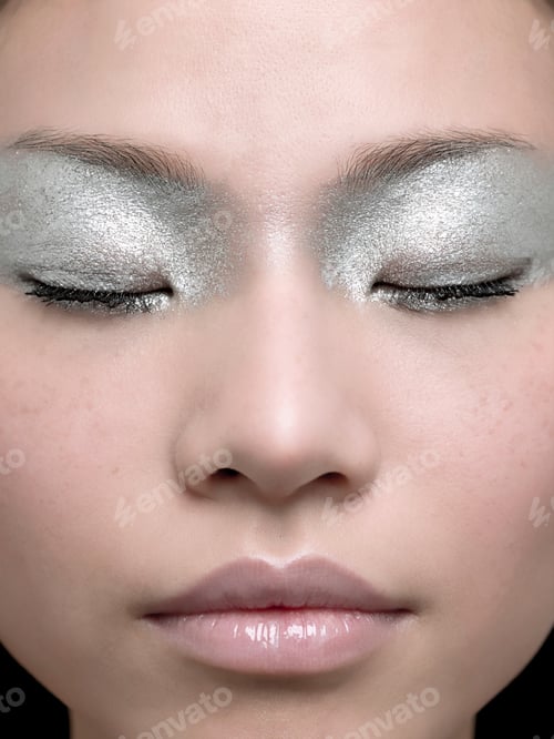 Preview: Closeup portrait of a person with silver eyeshadow