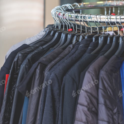 Preview: Dark autumn clothes hanging at a store