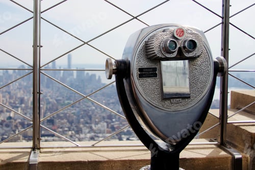 Preview: Viewfinder binoculars atop the Empire State Building overlooking cityscape