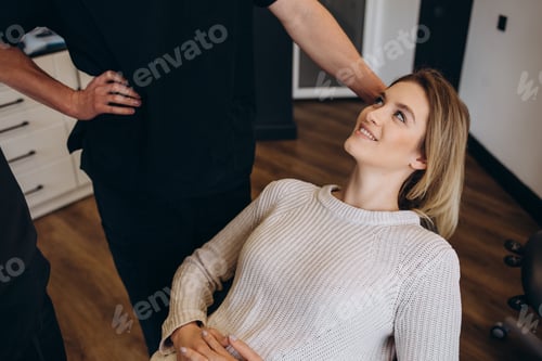 Preview: Beautiful and happy blonde woman at beauty medical clinic.