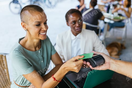Preview: Casual Outdoor Cafe Transaction, Customer Making a Payment with a Green Card
