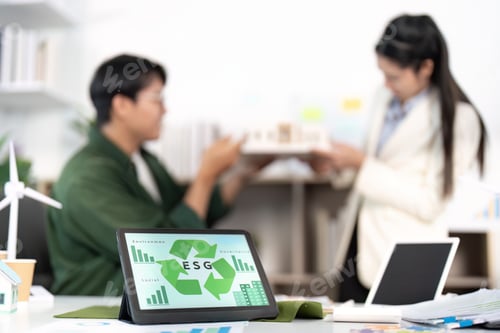 Preview: ESG Collaboration. Professionals discussing sustainability strategies in a modern office.
