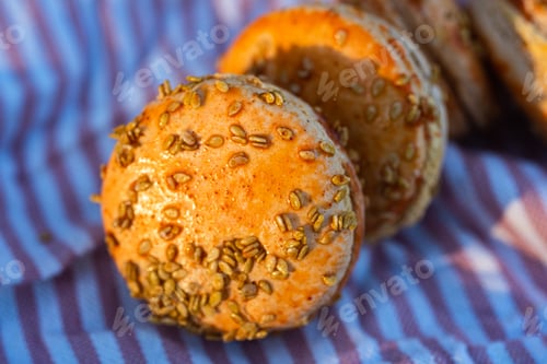 Preview: sesame seed textured orange color pumpkin flavor macarons