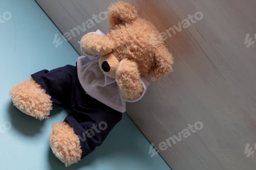 Preview: Teddy bear in an empty child room, covering eyes