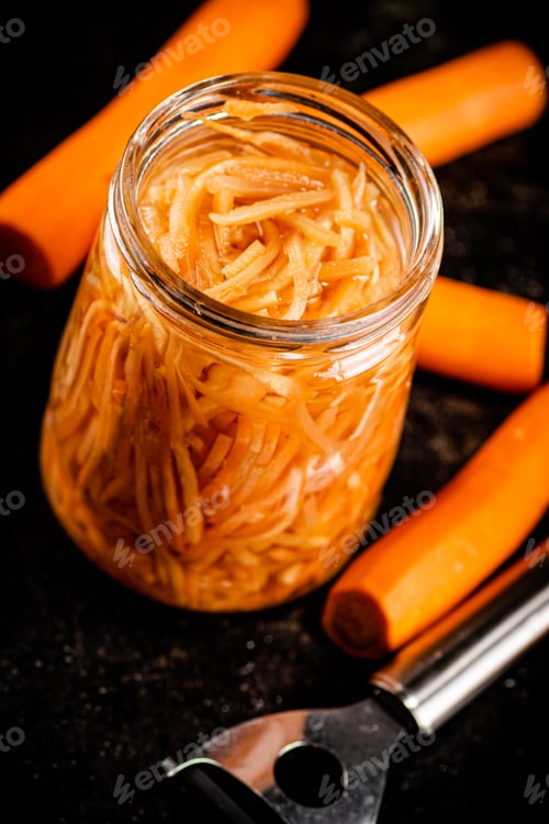 Preview: Canned carrots in a glass jar.