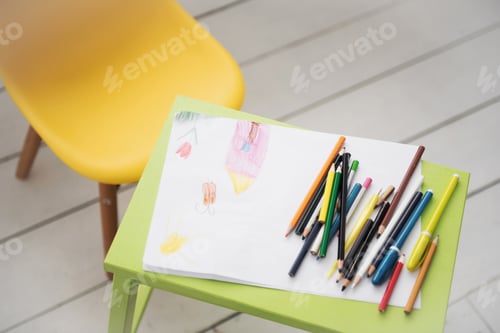 Preview: A frame with a kid drowing and colored pencils