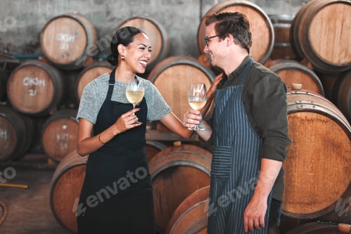 Preview: Winemaker having fun and talking at winery, white wine tasting and laughing, celebrating a good qu