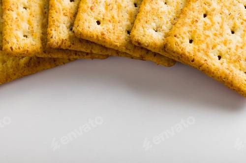 Preview: Close-up of crackers arranged on white background with copy space