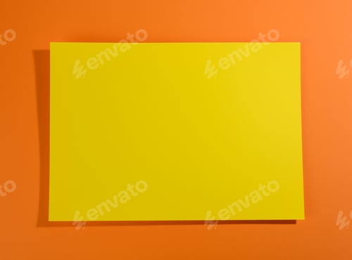 Preview: Blank yellow sheet of paper on orange background with shadow