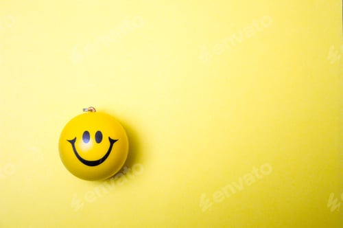 Preview: Photo of a yellow smiley face on paper background