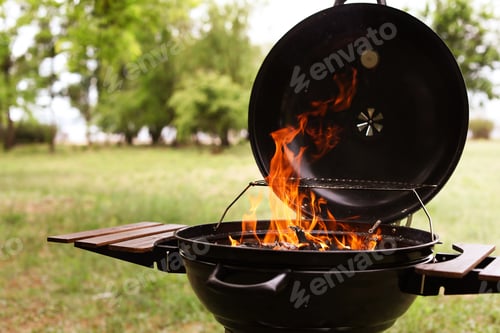 Preview: Modern barbecue grill with fire flames outdoors