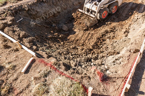Preview: Small Bulldozer Digging In Yard For Pool Installation