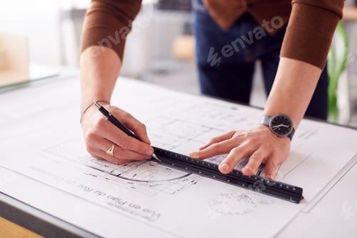 Preview: Close Up Of Male Architect In Office Drawing On Plan Or Blueprint With Ruler