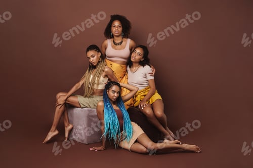 Preview: Young black four women posing together on camera