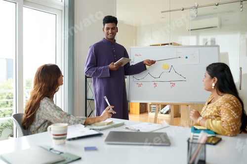 Preview: Businessman Showing Chart on Whiteboard