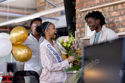 Preview: Congratulating woman with flowers and balloons, African American colleagues celebrating success