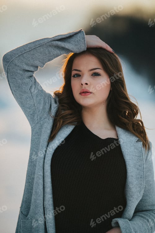 Preview: Young beautiful Bosnian woman in a jacket posing outdoors in the winter