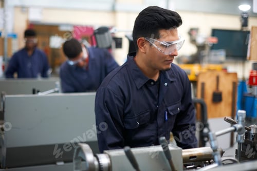 Preview: Student operating machine in workshop