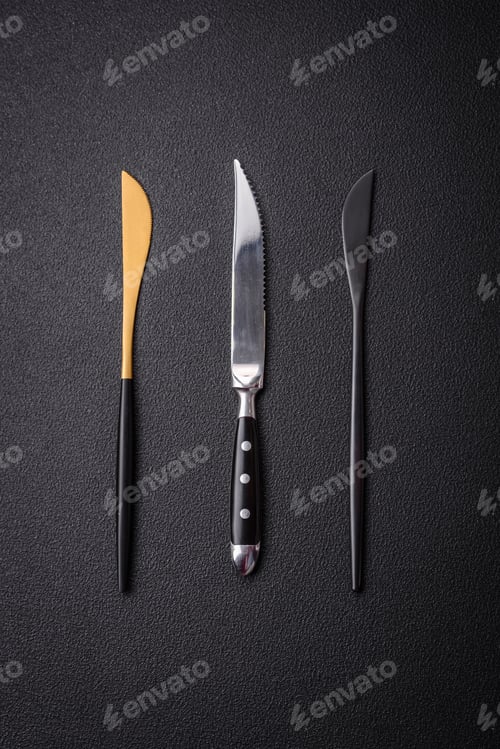 Preview: Kitchen knife made of steel on a dark textured background