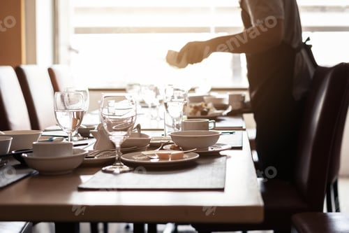 Preview: Empty dirty glasses and plates on dinning table in restaurant