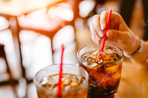 Preview: Two glass soft drink with ice in restaurant background.