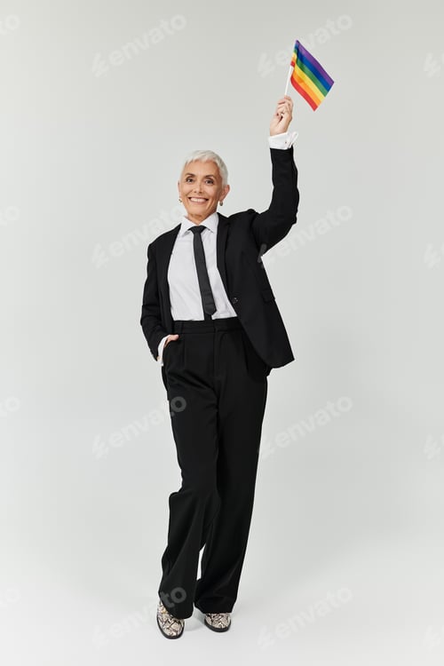 Preview: Confident Woman Celebrating Diversity in Stylish Attire With Rainbow Flag
