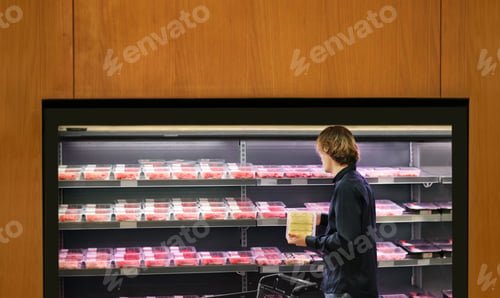 Preview: Man Purchasing A Packet Of Meat At The Supermarket