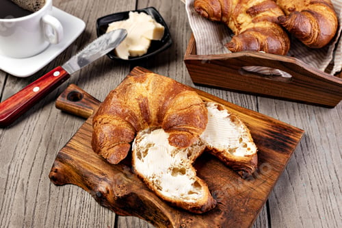 Preview: Fresh croissants with butter
