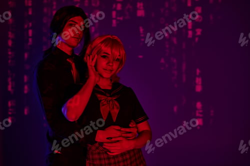Preview: trendy man hugging anime style woman in students uniform in red neon light on purple backdrop