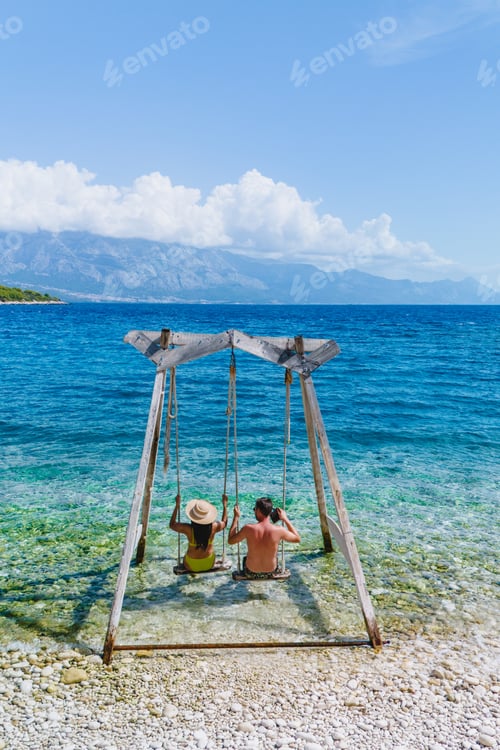 Preview: Relaxing on a swing overlooking the crystal clear blue waters of Brac Island, Croatia