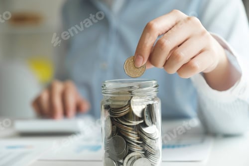 Preview: Woman Saving Money in Glass Jar at Table