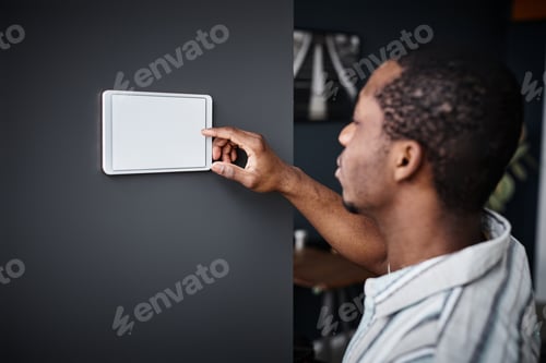 Preview: Black Man Using Domotics System