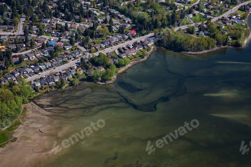 Preview: Aerial picture of a sandy beach in front of luxury homes in a neighborhood of North Vancouver