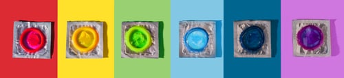 Preview: Six condoms of different colors on colorful background