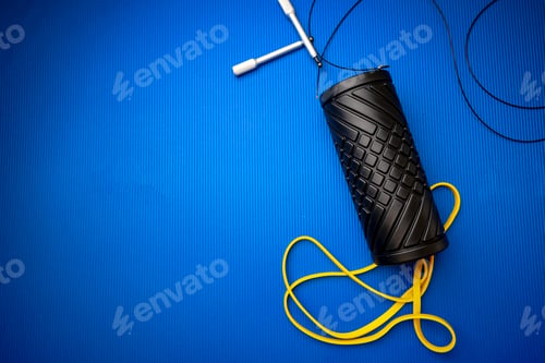 Preview: Sport fitness foam roller on blue mat