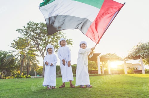 Preview: children playing together in Dubai in the park.