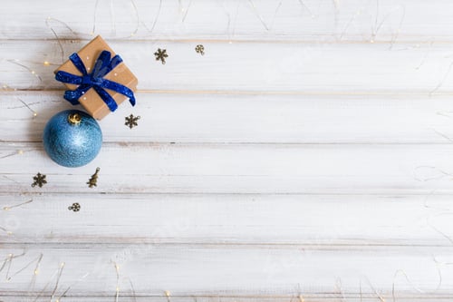 Preview: Christmas gift box and branch christmas tree and ball toy and cone on white wooden background