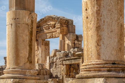 Preview: Ruined ancient building made of large towers and rocks under a clear sky