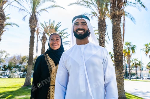 Preview: Traditional arab couple wearing emirati clothing dating outdoors