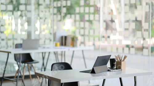 Preview: Contemporary workplace with modern tablet and office supplies.