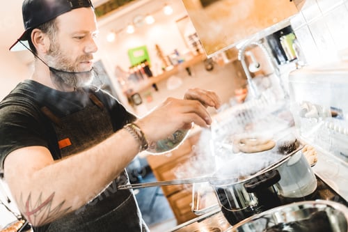 Preview: Pretzel being prepared and parboiled in Boiling Water.