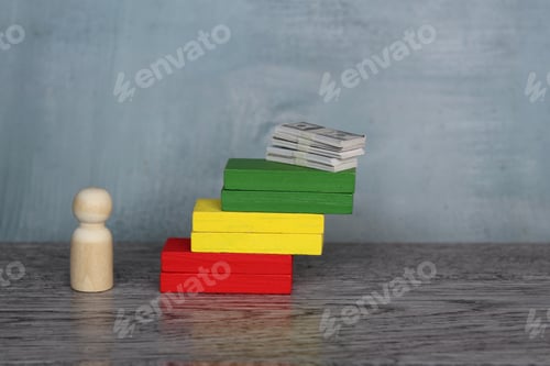Preview: Wooden doll and stack of money on top of staircase
