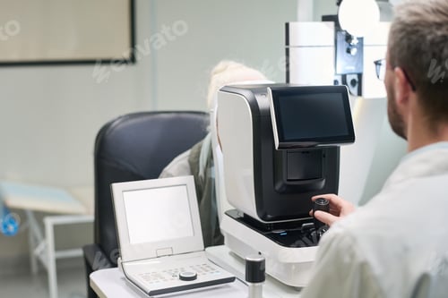 Preview: Senior Woman Undergoing Eye Examination with Ophthalmologist