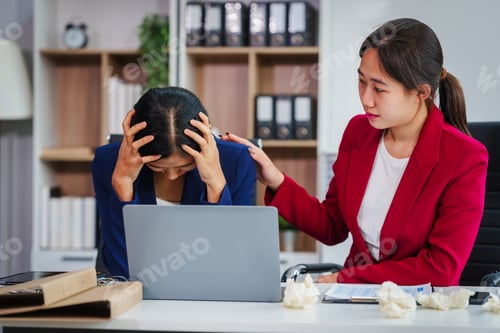 Preview: Two Asian businesswomen under stress and pressure discuss financial matters, experiencing anxiety