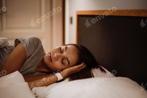 Preview: Brunette beautiful caucasian woman sleeping in bed at home