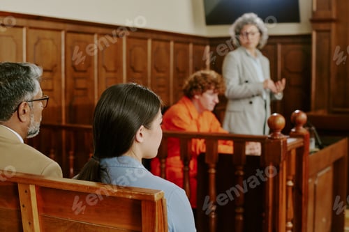 Preview: Caucasian Young Adult Man Sitting in Courtroom during Legal Proceedings