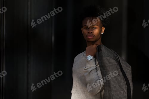 Preview: Black businessman posing on street