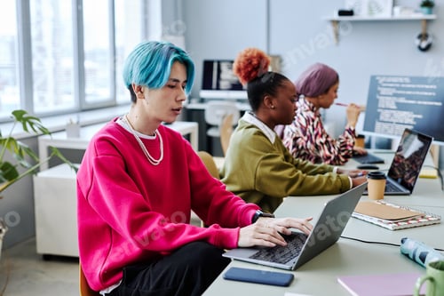 Preview: Diverse team of gen Z software developers working in office