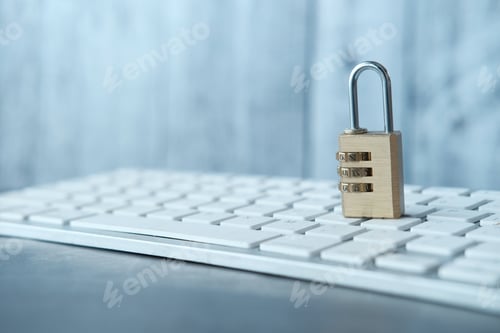 Combination Padlock on White Keyboard Protecting Data